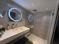 Bathroom with rainfall and handheld shower