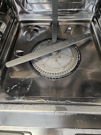 The dishwasher smell is from old food in the filter
