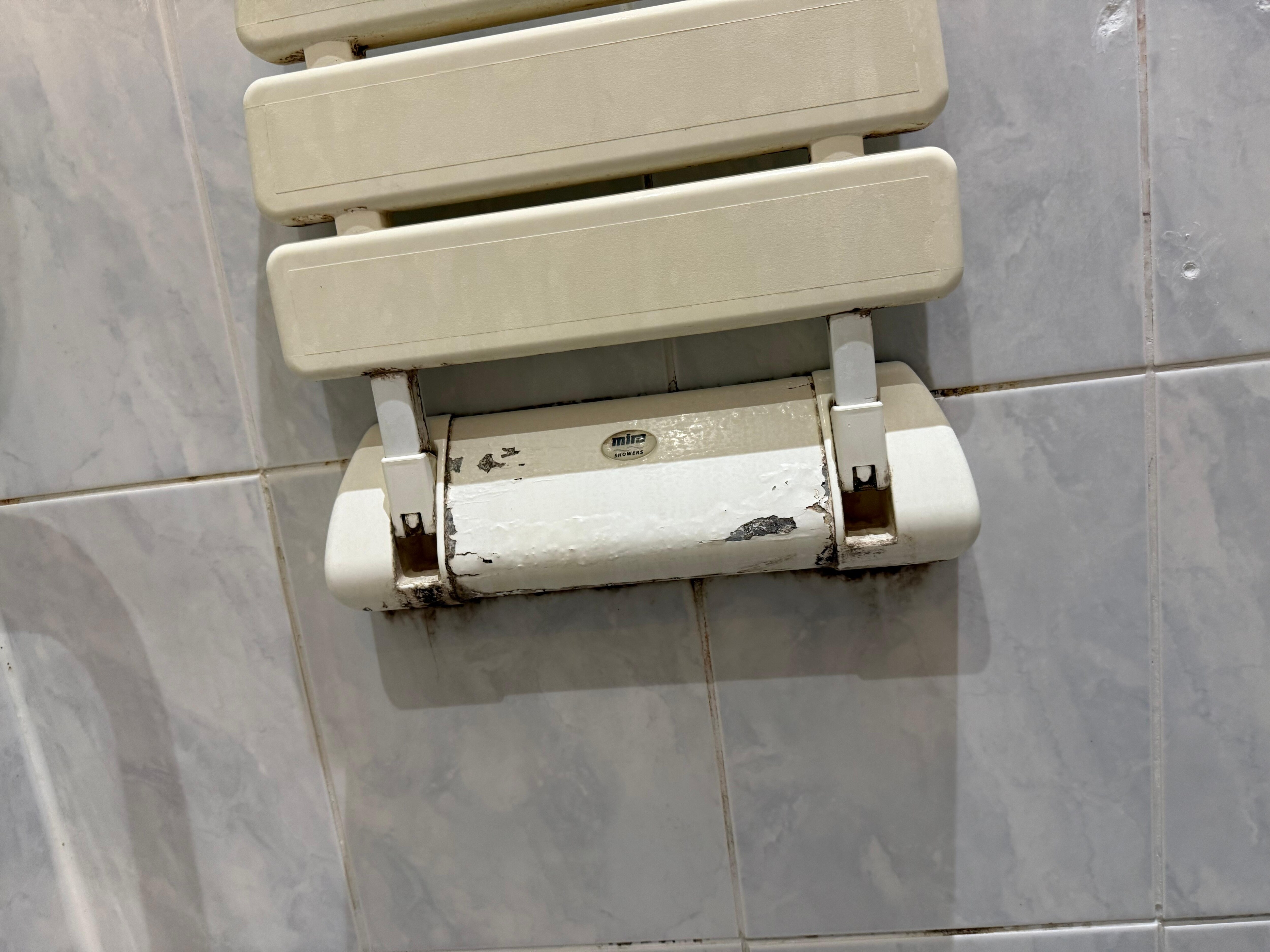 Peeling off surface of shower seat
