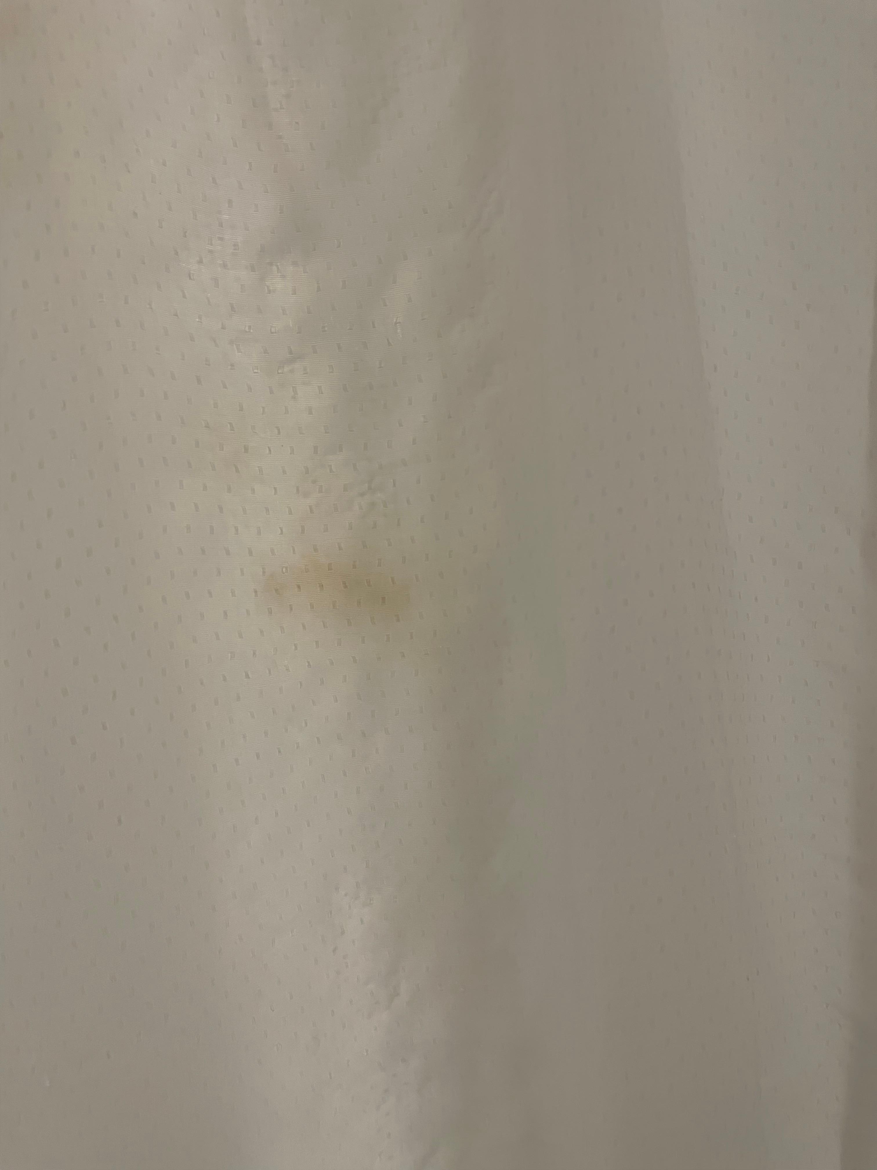 Brown spots on the shower curtain 