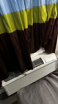 Black mold on bottom of curtain blowing into room from AC