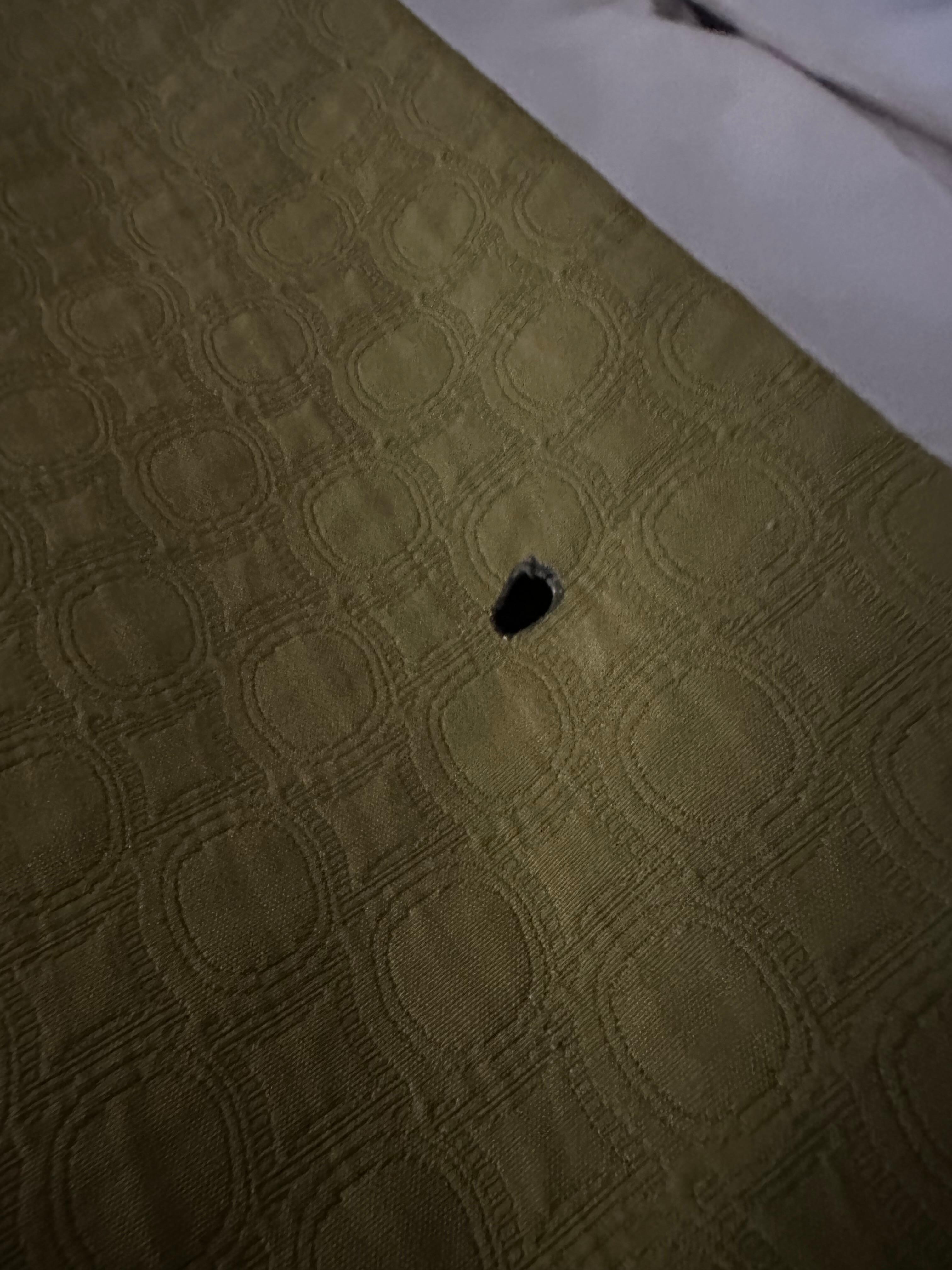 Cigarette burn on linen 