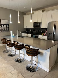 Kitchen, is supplied with liquid soap, dishes, stove top pans, no baking pans. Has a crockpot, toaster, coffee maker. Has 3 garbage bags supplied. Bring coffee, and salt & pepper.