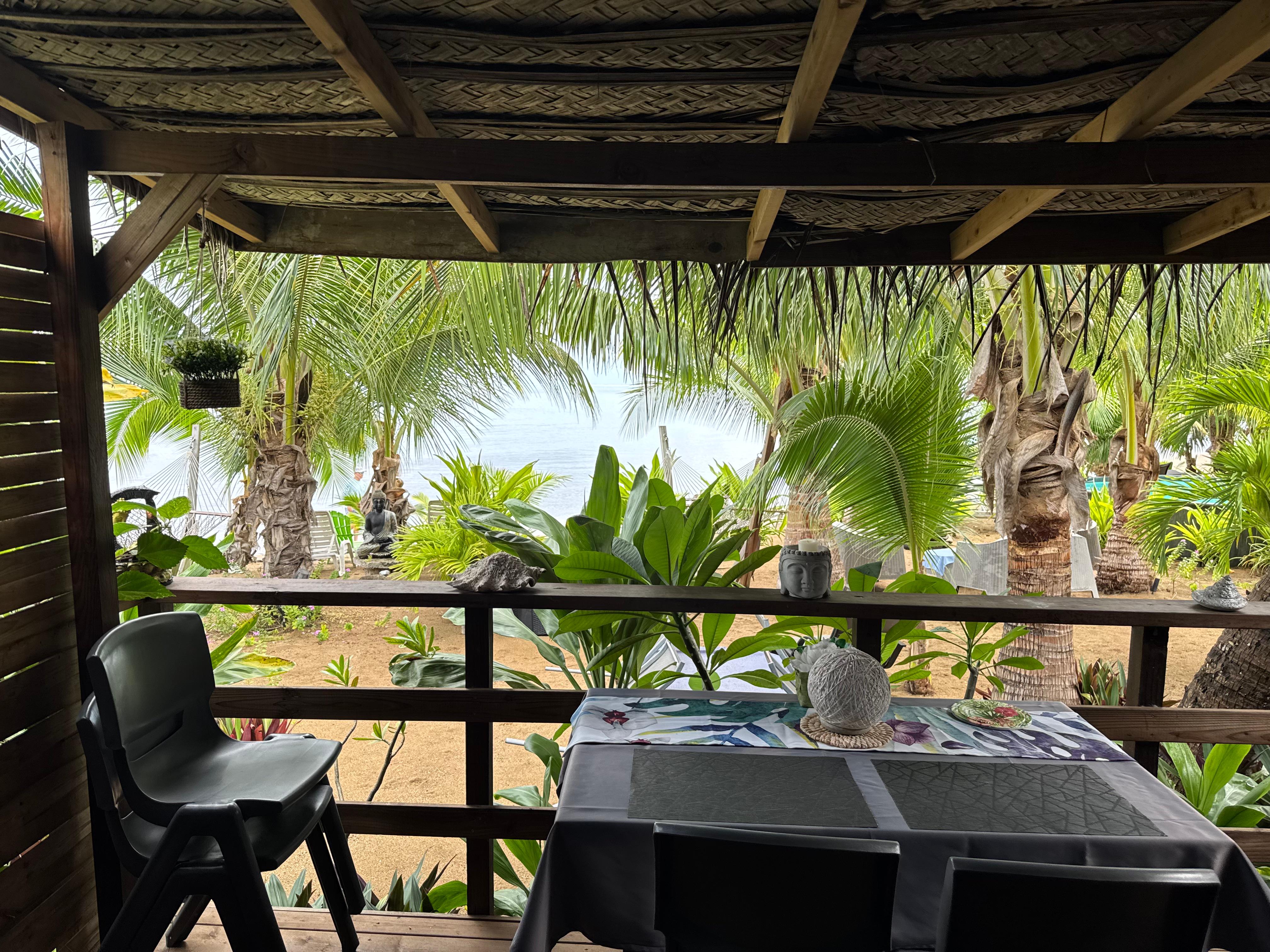 View of our porch, common area and beach from our living room.