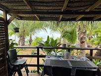 View of our porch, common area and beach from our living room.
