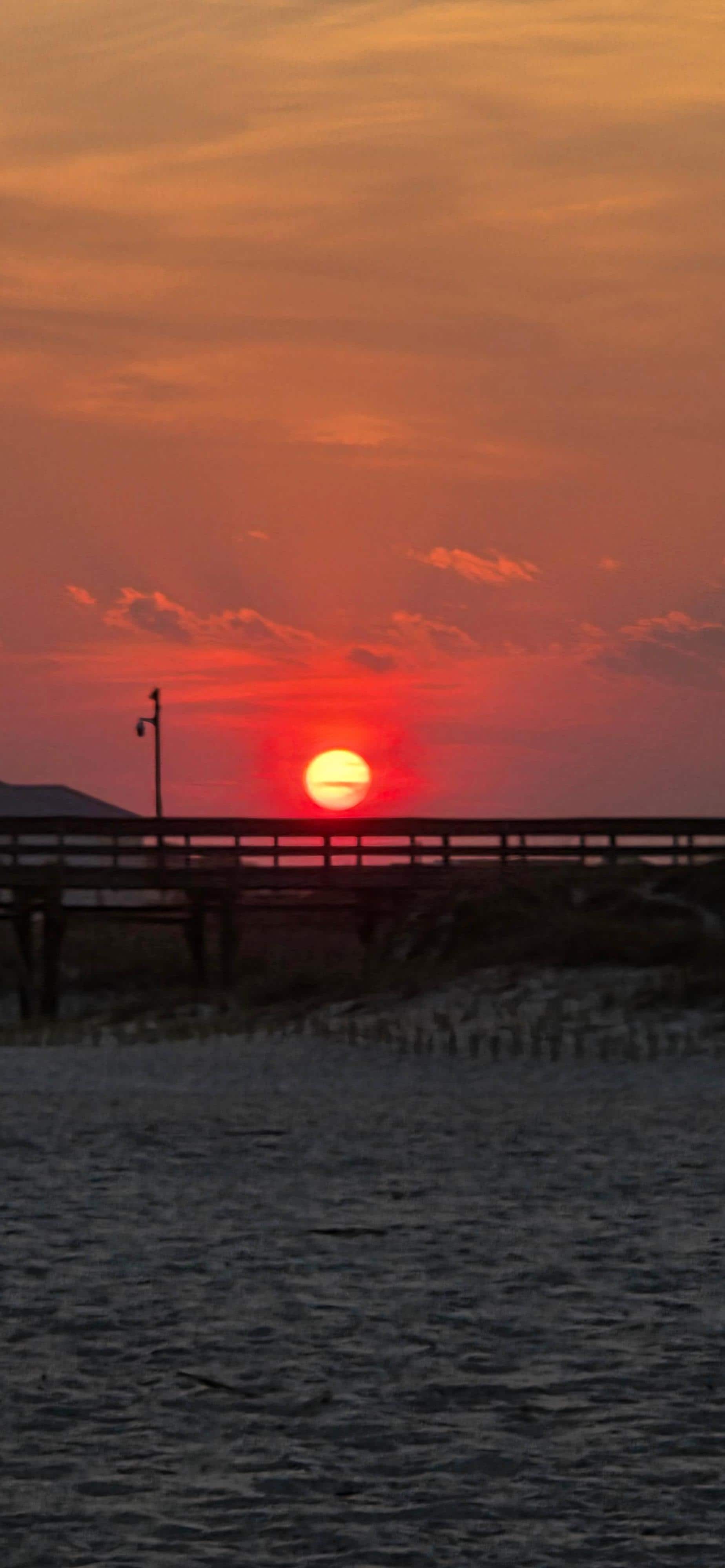 Sun setting behind the pier. 