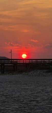 Sun setting behind the pier.