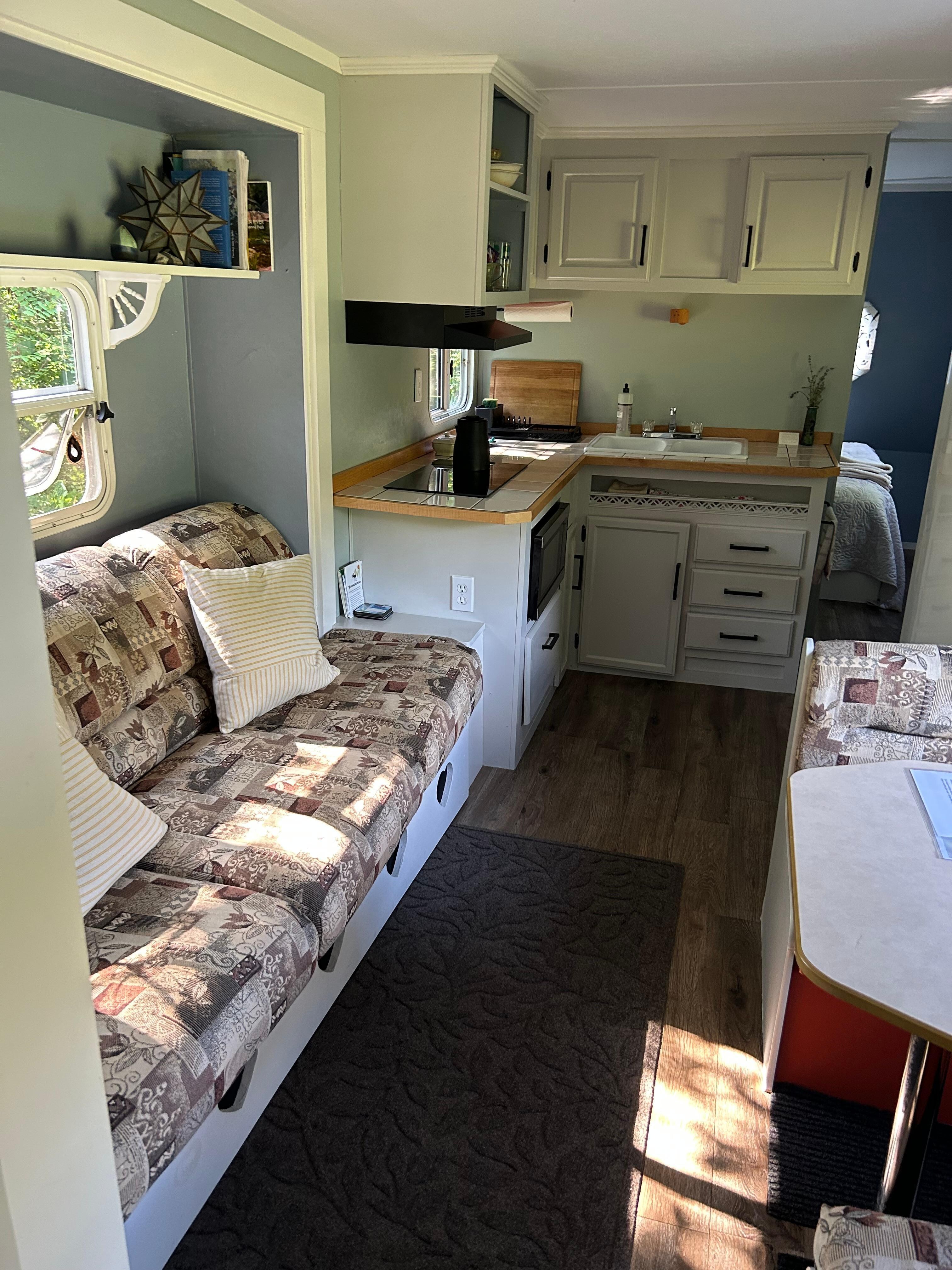 The inside of the camper. Plenty of space for at least 3 or 4 guests. So cute!