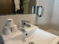 Soap and plastic cups in bathroom