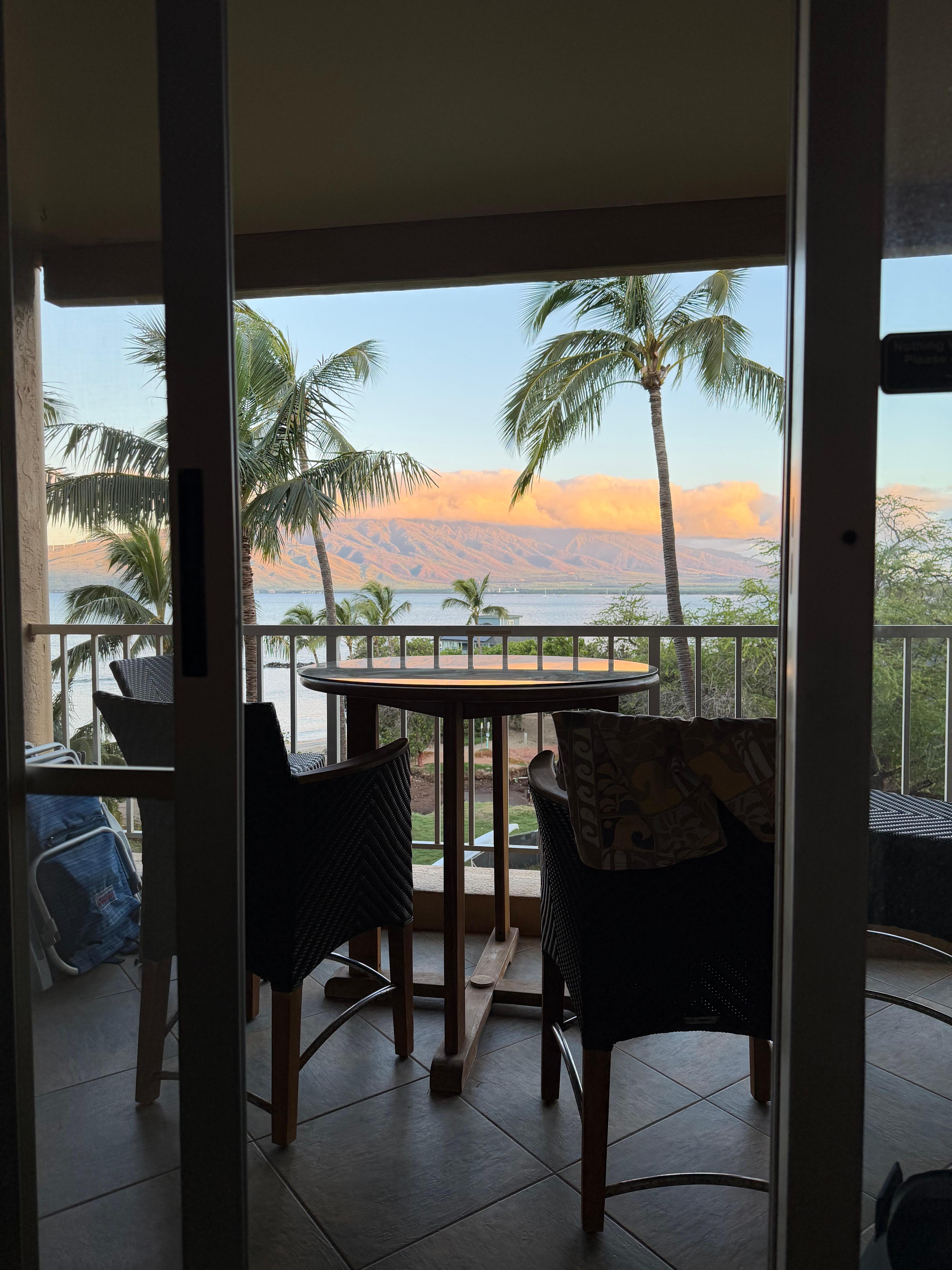 Sunrise cloud over the West Maui Mountains looking out from inside unit