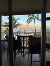 Sunrise cloud over the West Maui Mountains looking out from inside unit