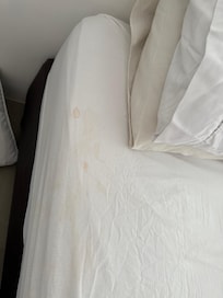 Blood stained sheet on the bed