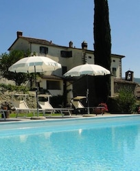 View toward the villa from the west side of the pool. The small chapel is visible here.