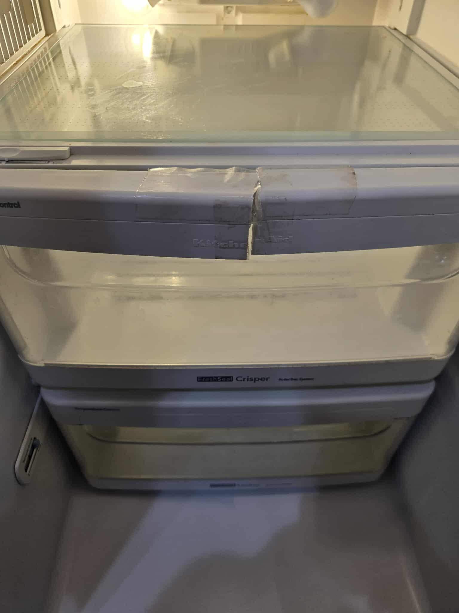 Refrigerator drawer was broken and impossible to open.