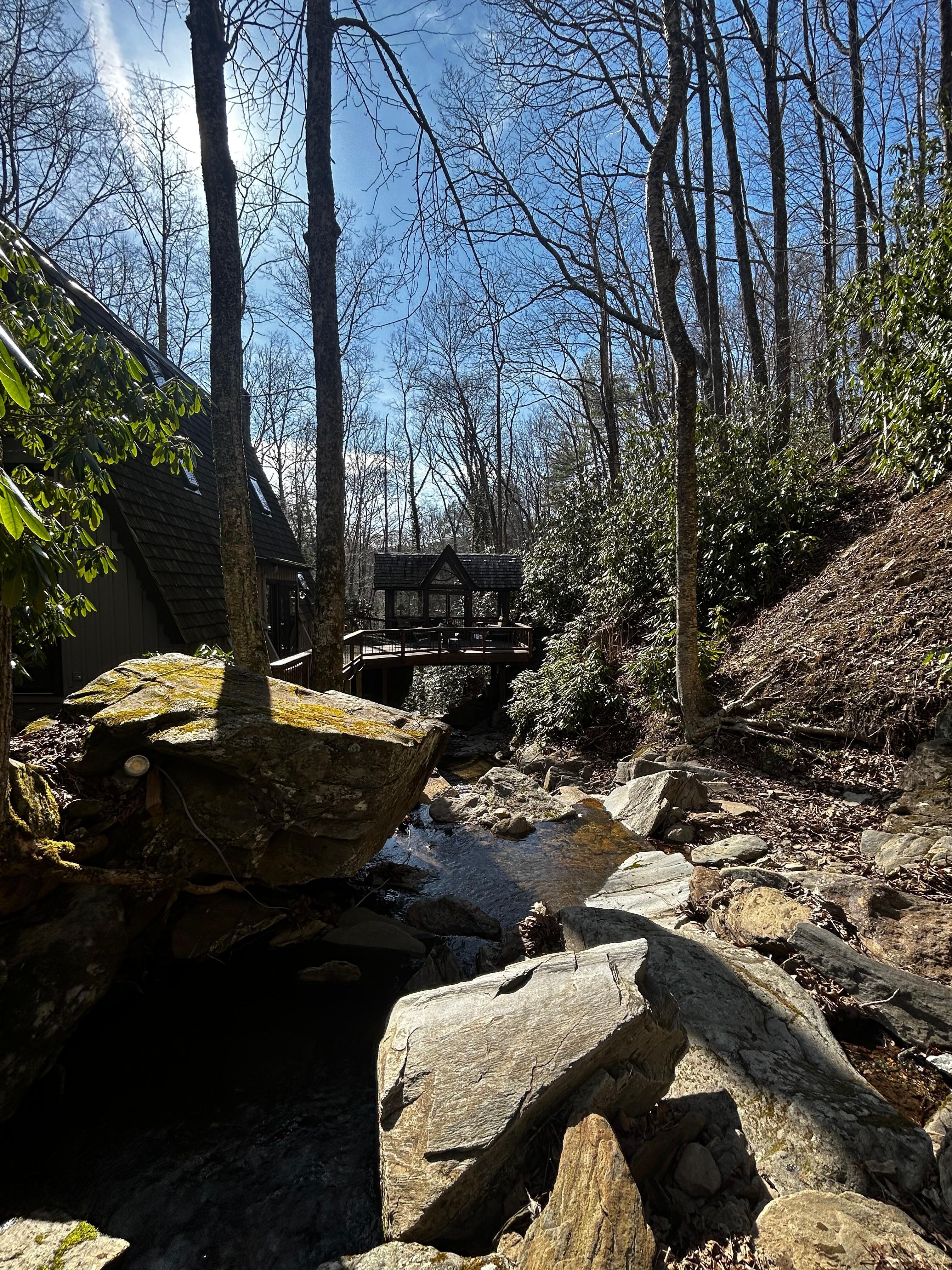 View of the outdoor living space from the creek