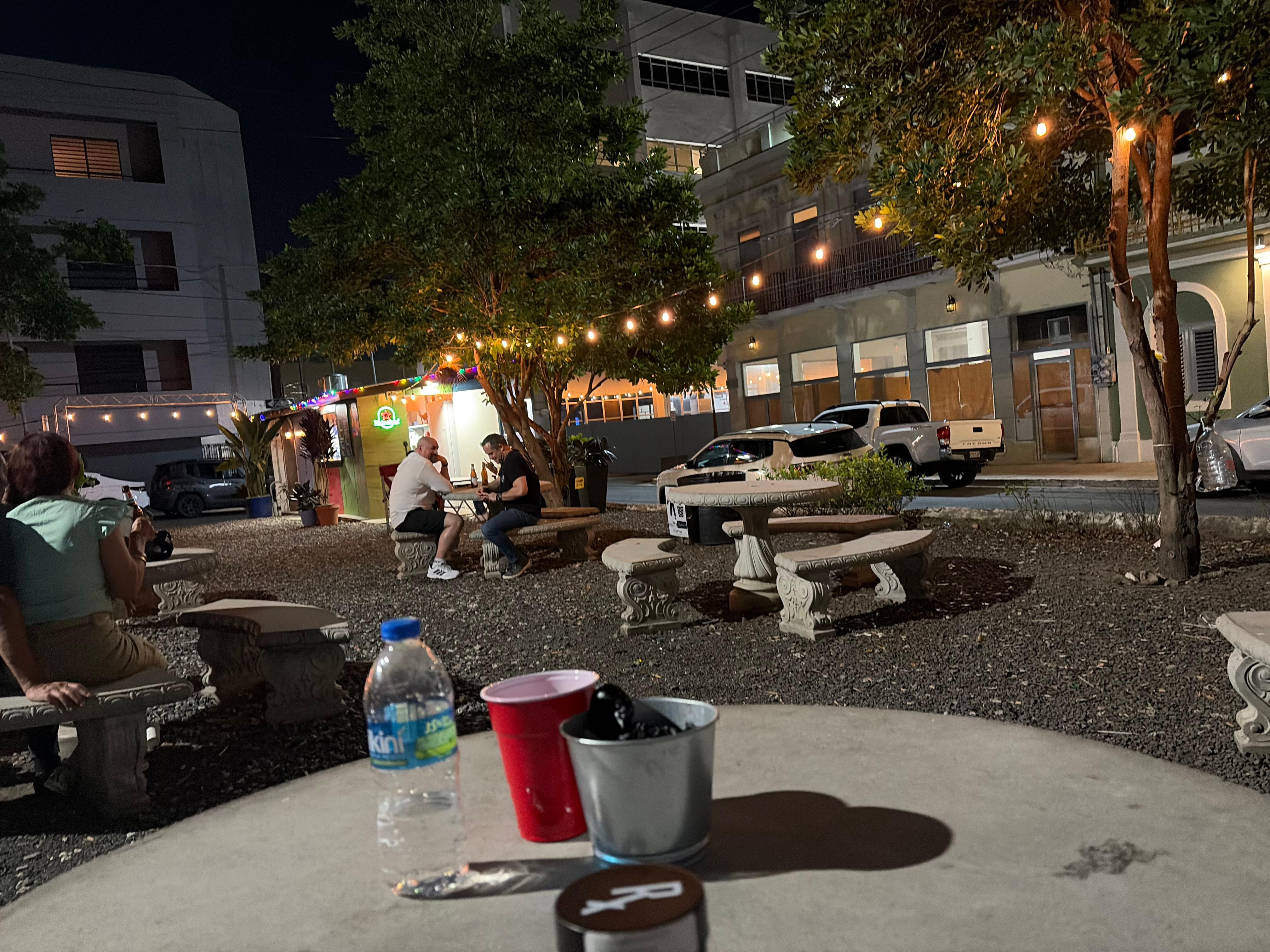 The courtyard across from the hostel with street food stand and bar 