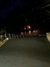 The house from the 45 degree turn in the driveway