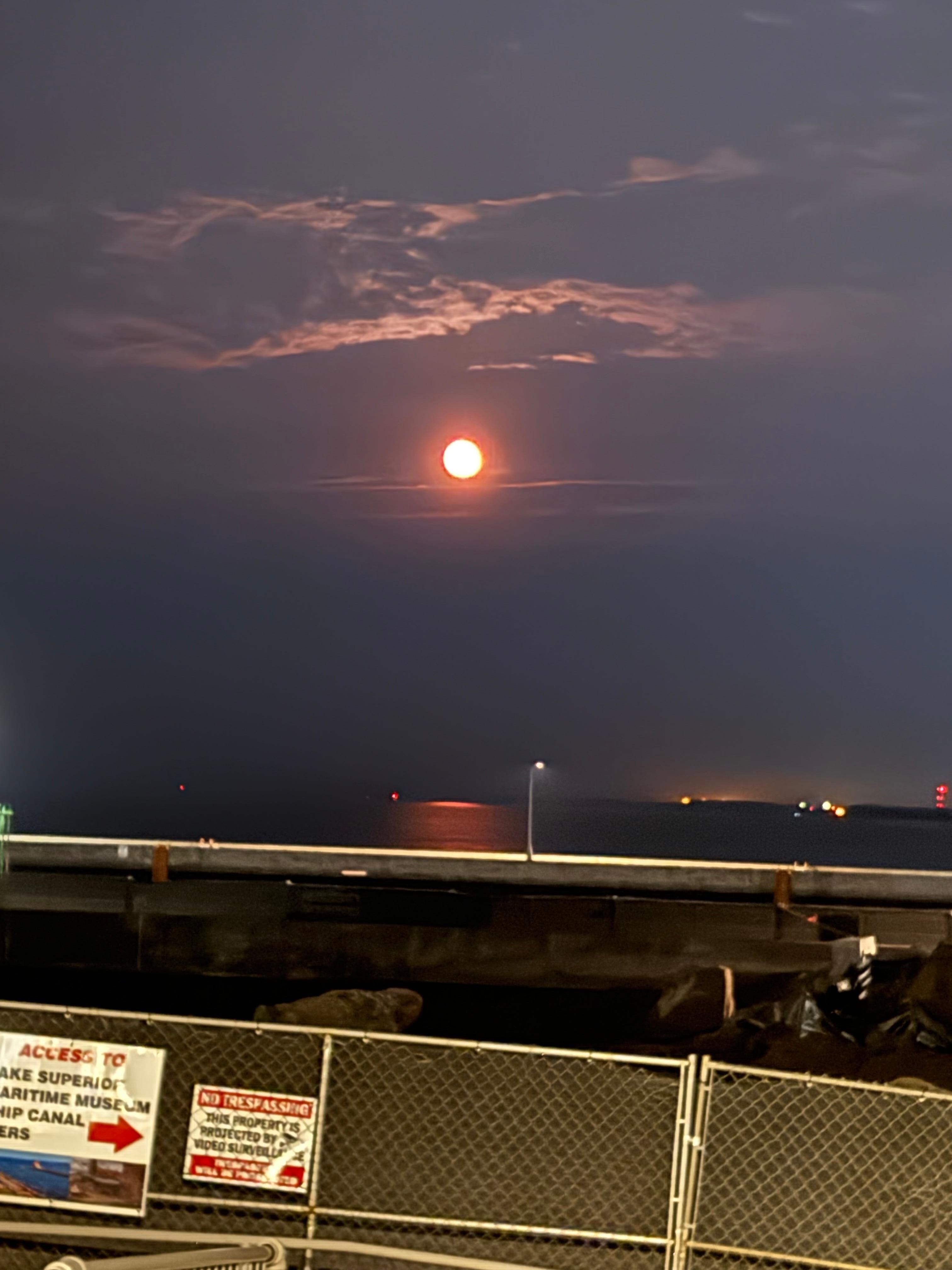 Full moon coming up over the lake
