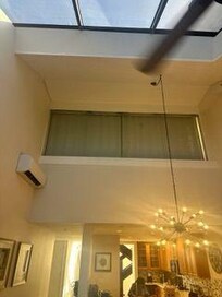 one single unadequate unit for huge vaulted space (living room, dining, kitchen, hallway, and vaulted 2-story foyer