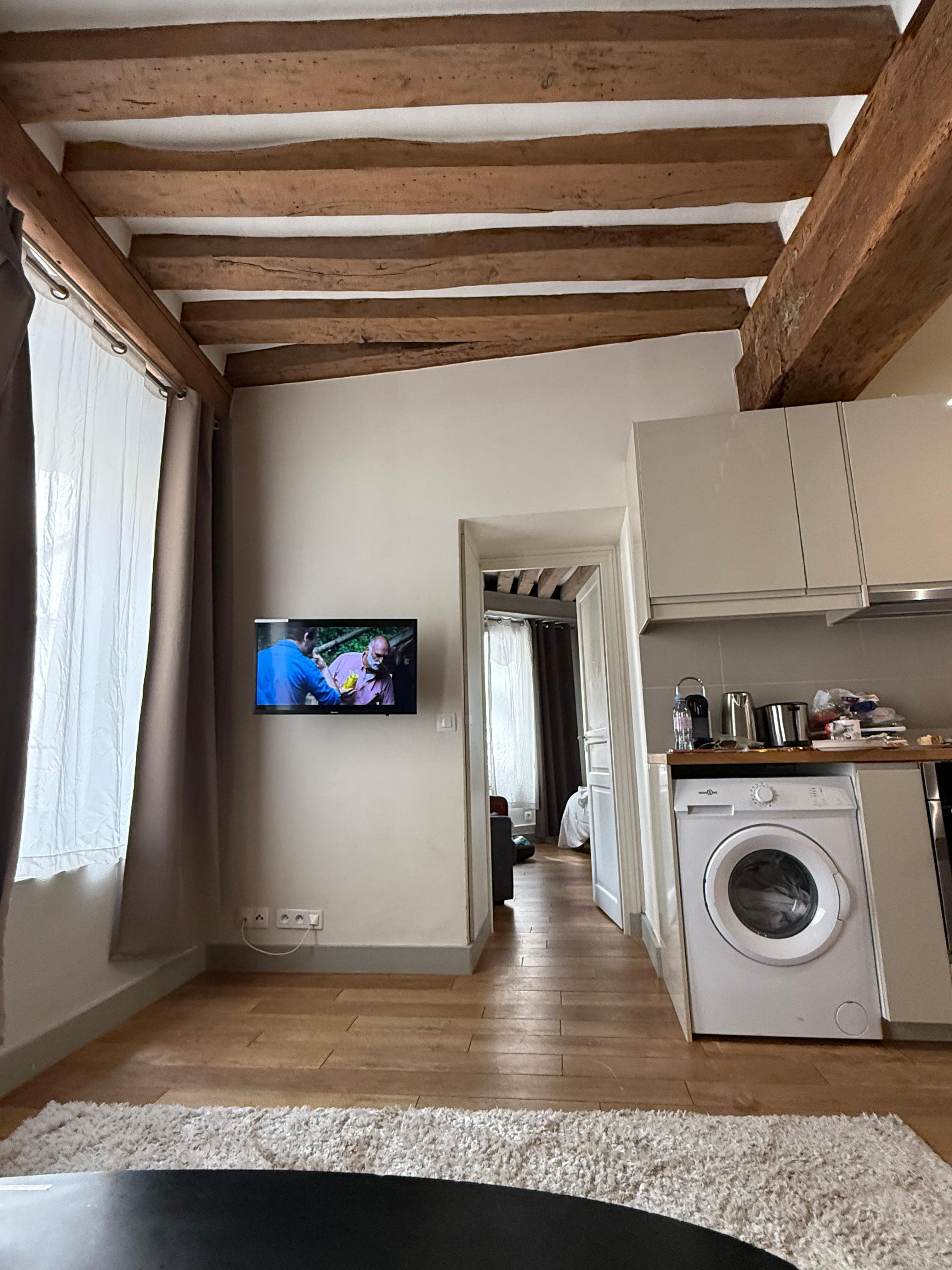 Kitchen - you can see the washer placement is different than the listing.  Notice the ceiling beams, they ARE different.
