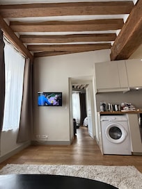 Kitchen - you can see the washer placement is different than the listing. Notice the ceiling beams, they ARE different.