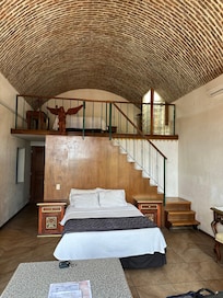 Double Beds, one below one in loft. Really creative sky light too.