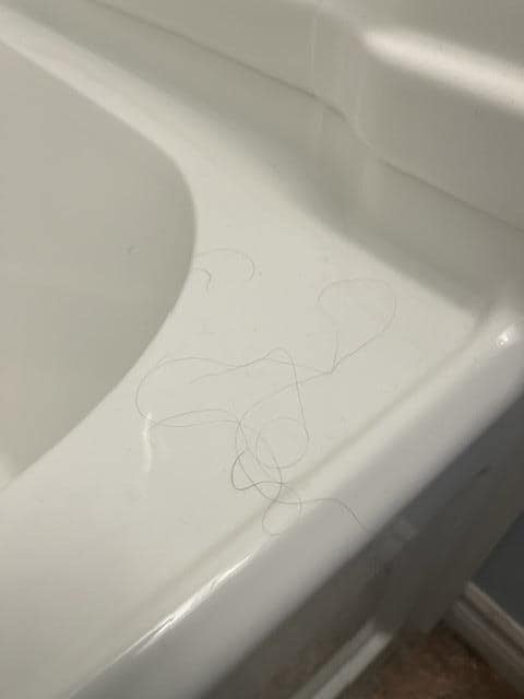 Hair all over bathroom and inside towels