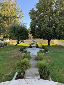 Walkway up to house fully fenced yard