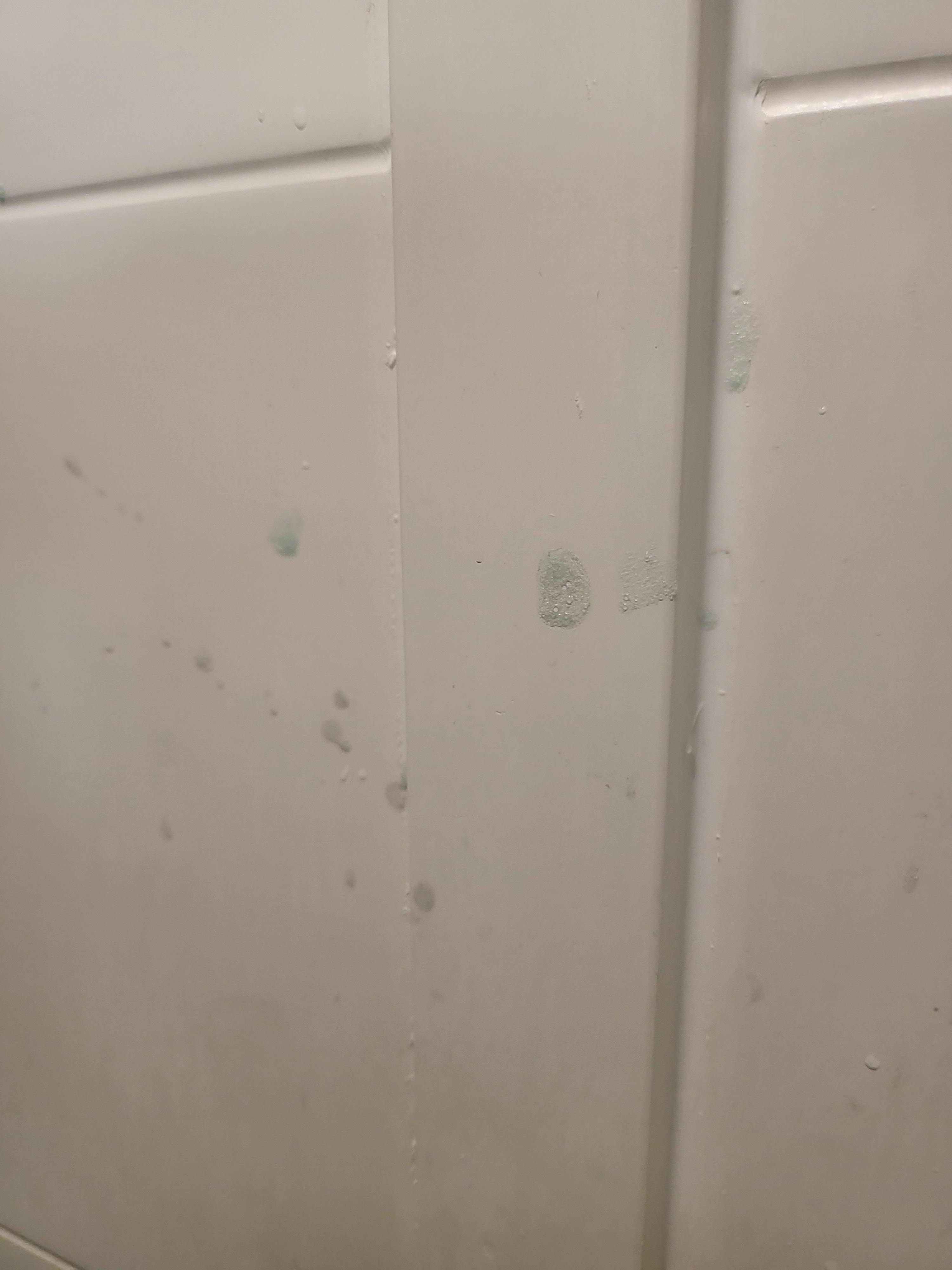 Soap scum on wall