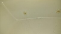 Paint and built up filth that I had to clean before finding out the tub SUCKED AS BAD AS THE HOTEL
