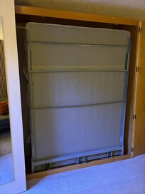Murphy bed in wall. Very convenient can be up for more space in room or down to sleep.