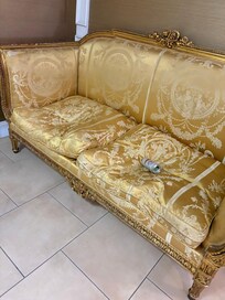 Worn out old sofa as you get off the elevator. More trash