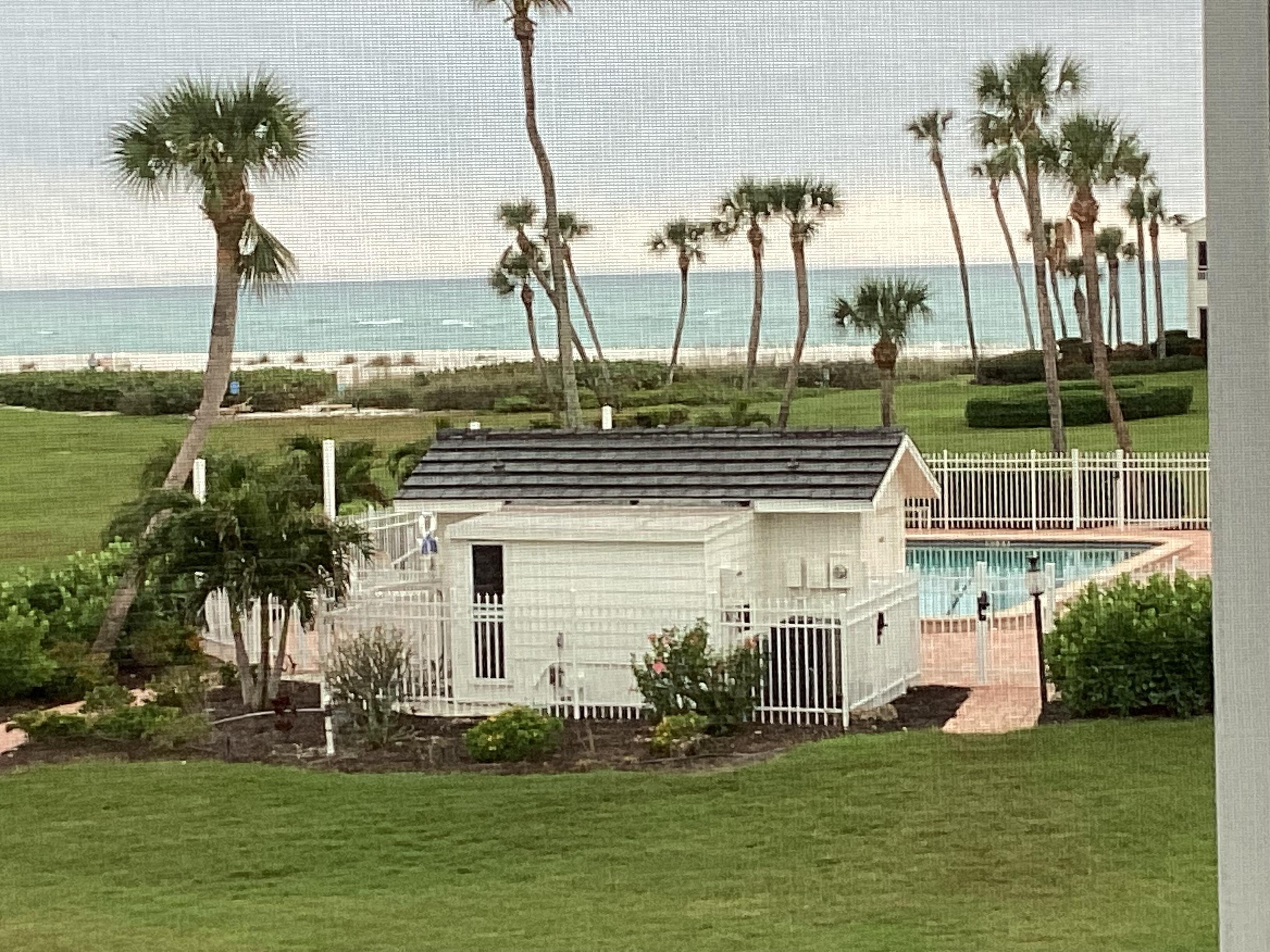 A view from the condo lanai overlooking the pool and the beach.