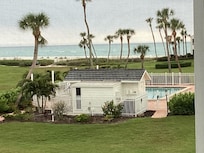 A view from the condo lanai overlooking the pool and the beach.