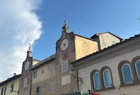 Charming clock and wind gauge. Next to butcher, church, gelato, cafe!