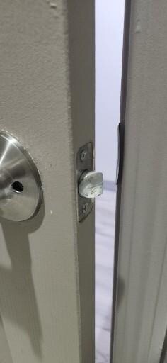Backwards bathroom door handle. As you can see it will not close and lock, imposable. If the door opened the other way, it would.