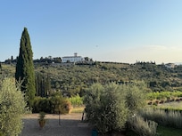 Hot air balloon in view from the villa in the early morning