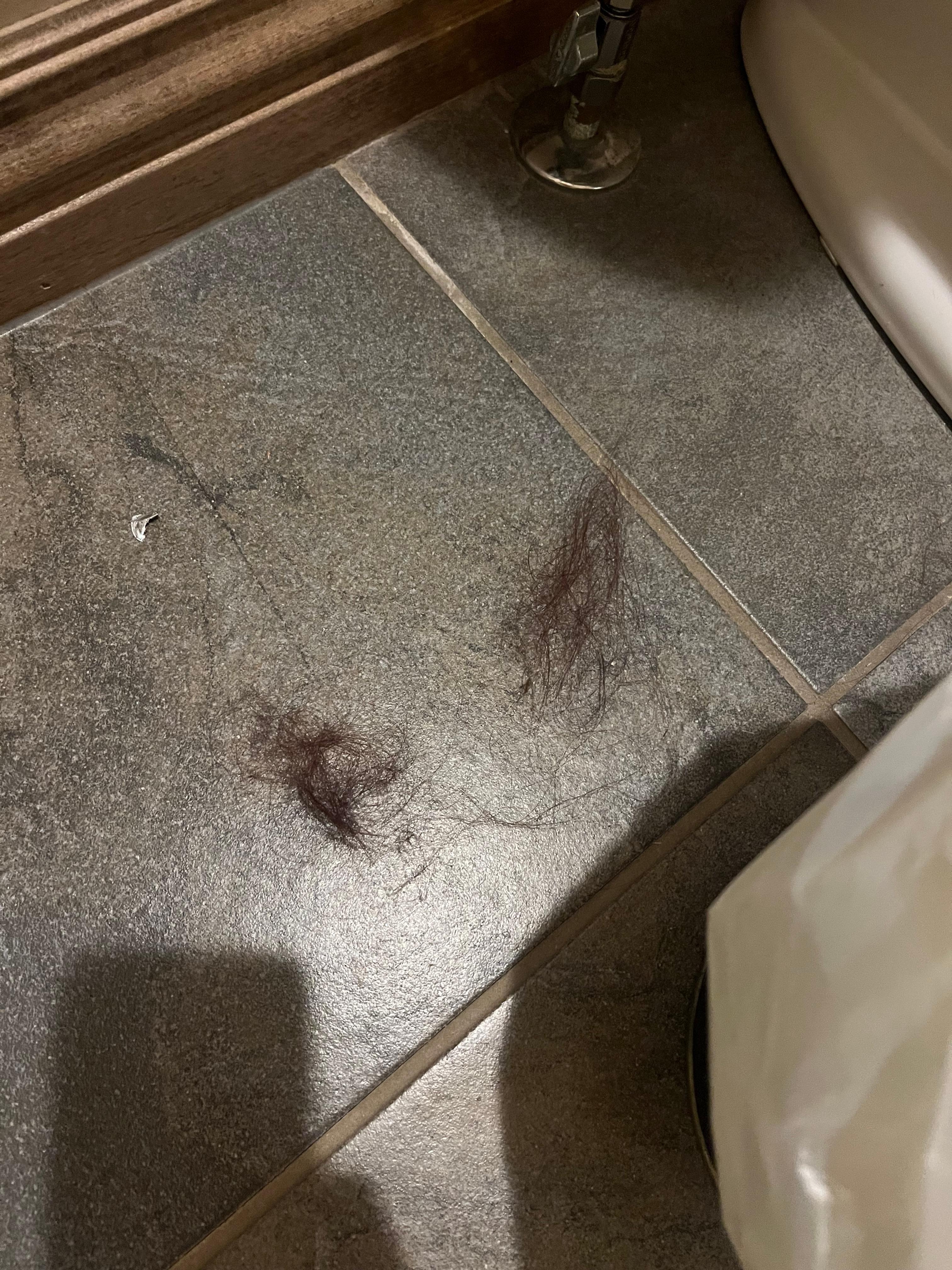 Hair on bathroom floor 