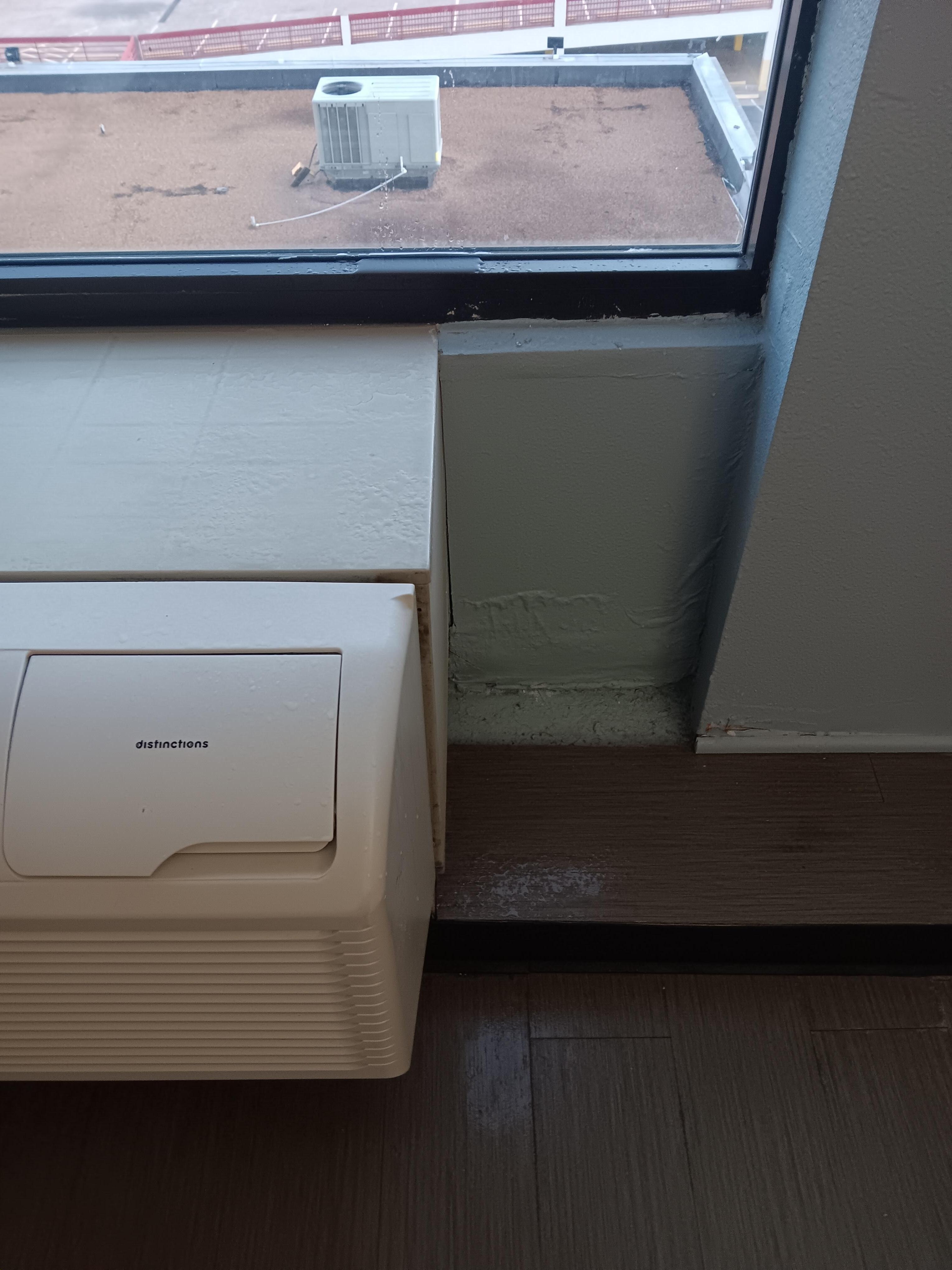 Water was leaking from ceiling near window onto air conditioner and then on the floor. 