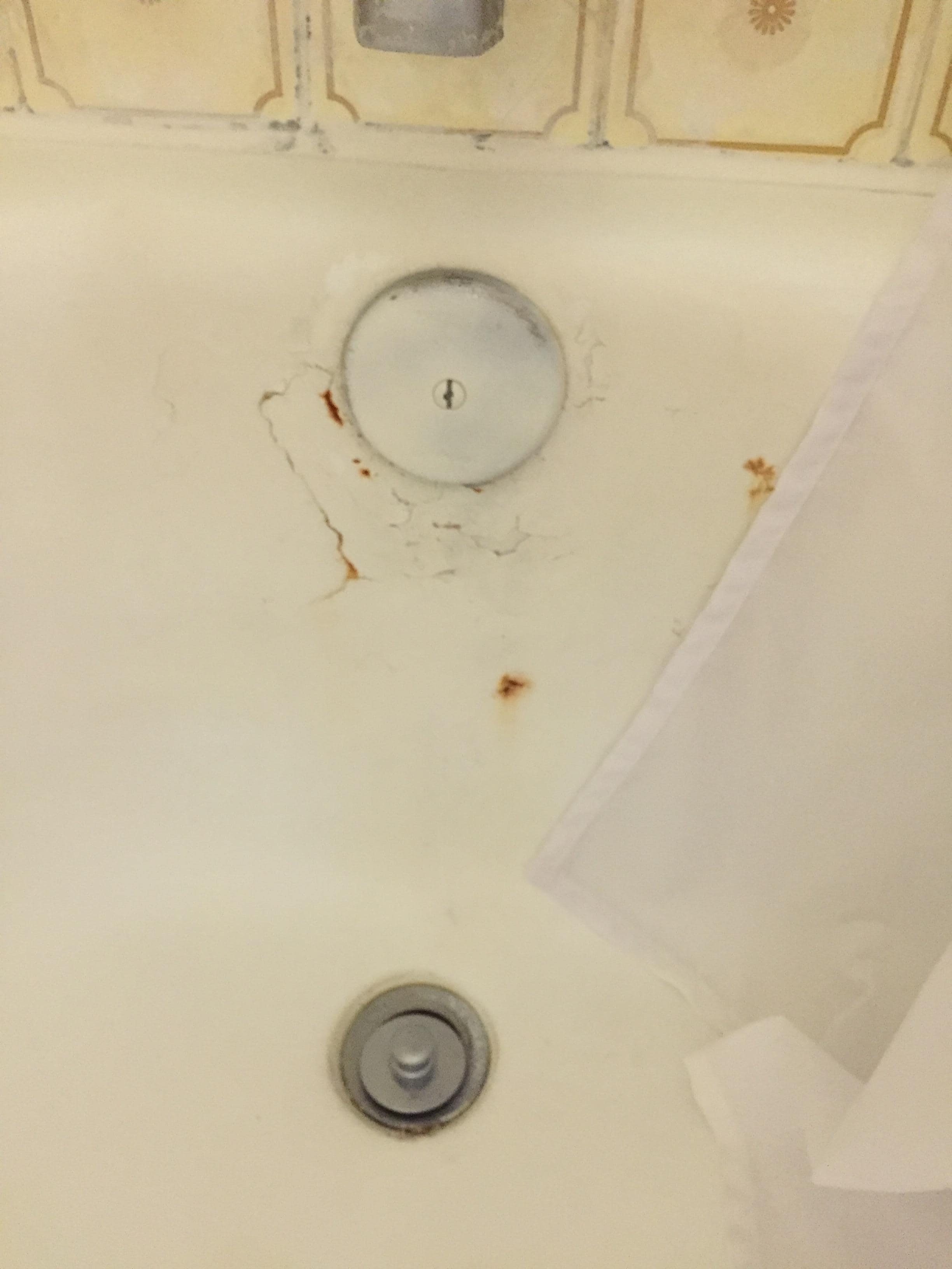 Bathtub was spray painted.