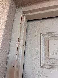 Room door covered in rusy