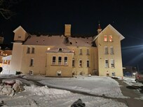 The top floor that has lights on is the loft.