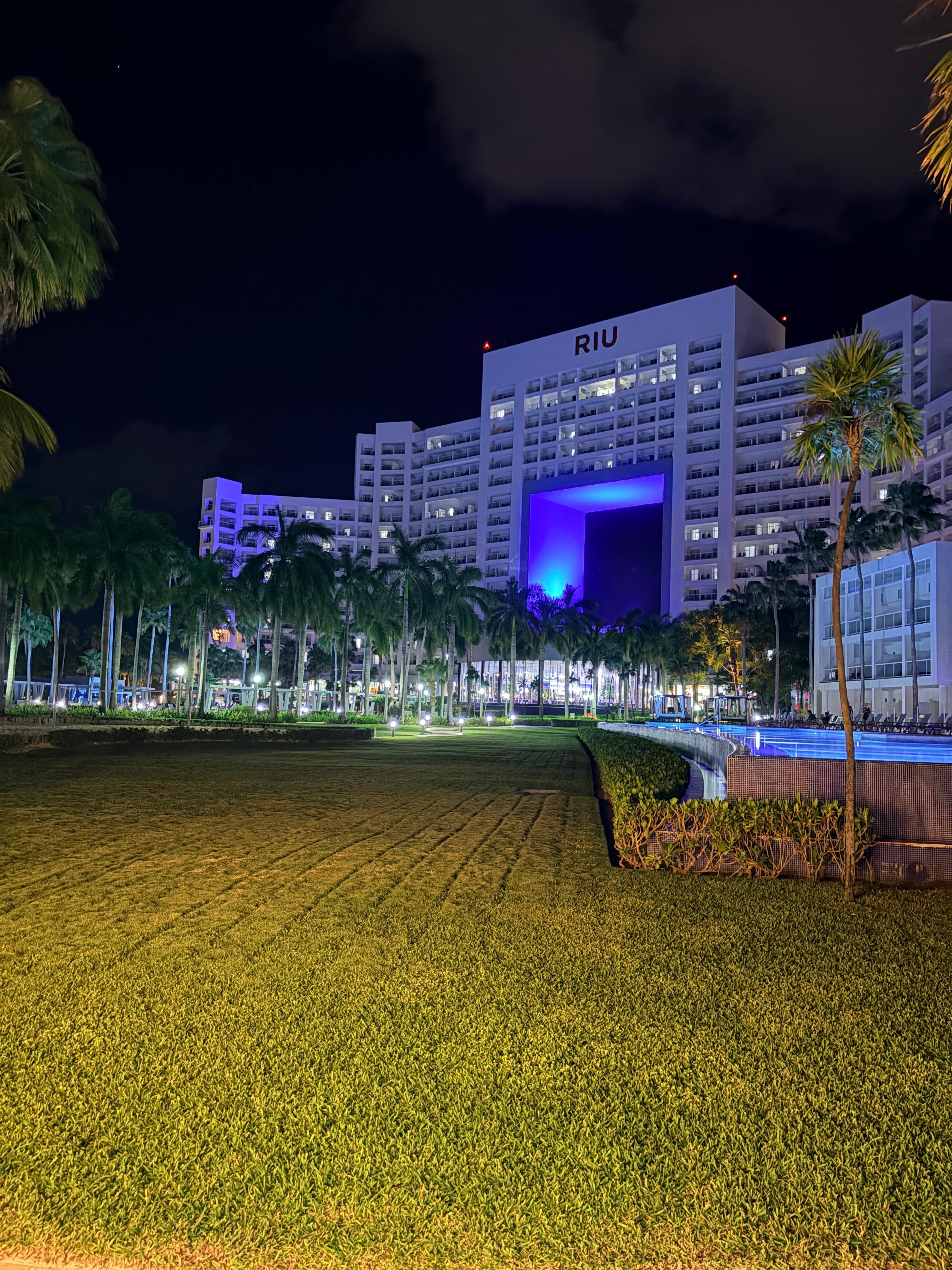 The hotel at night lit up. 