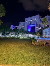 The hotel at night lit up.