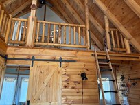 Cabin interior with view of loft.