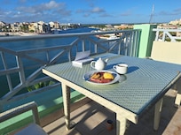 enjoying breakfast on balcony