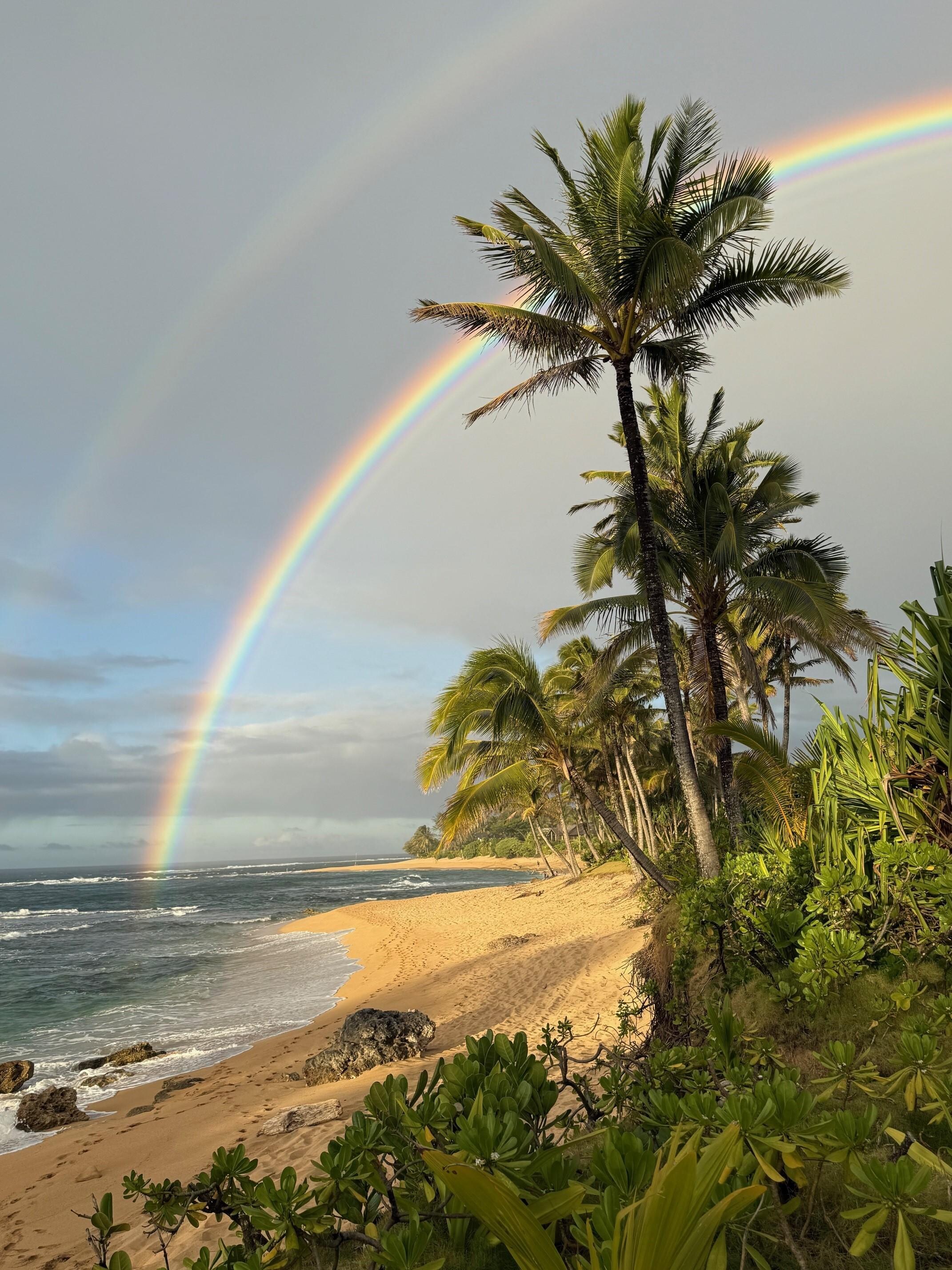 Beautiful rainbows often! This was taken from the yard of the house looking down on the beach.