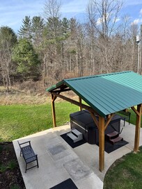 The hot tub with cover. Right off the lower level