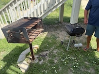 Outdoor grill (stickers and weeds covered this area)