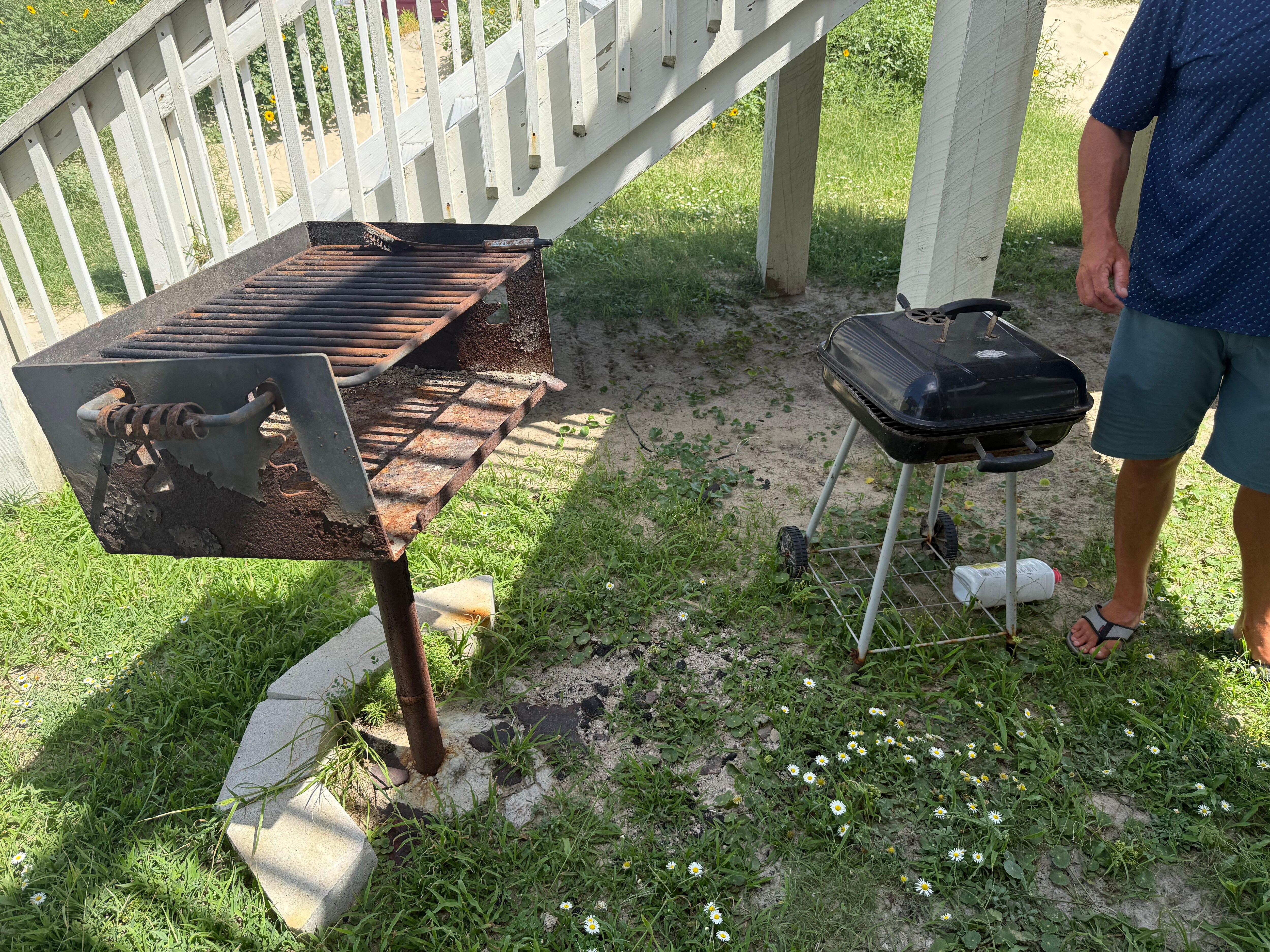 Outdoor grill (stickers and weeds covered this area)